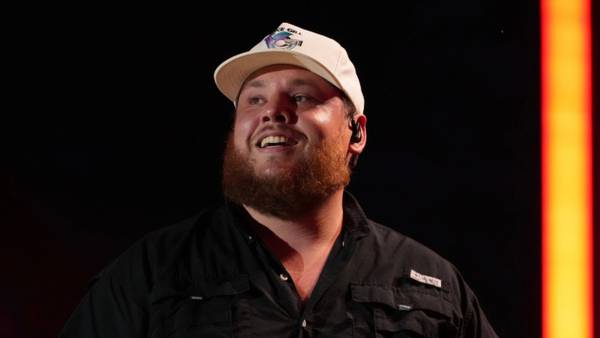 Luke Combs + Post Malone take a road trip in porta potties in "Guy for That" video