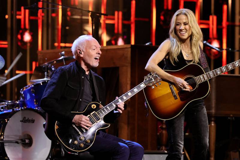 NEW YORK, NEW YORK - NOVEMBER 03: (L-R) Peter Frampton and Sheryl Crow perform onstage during the 38th Annual Rock & Roll Hall Of Fame Induction Ceremony at Barclays Center on November 03, 2023 in New York City. (Photo by Theo Wargo/Getty Images for The Rock and Roll Hall of Fame )