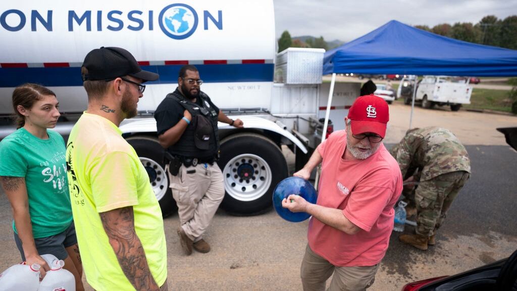 Hurricane Helene victims line up for water