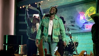 NASHVILLE, TENNESSEE - NOVEMBER 20: EDITORIAL USE ONLY Shaboozey performs onstage during The 58th Annual CMA Awards at Bridgestone Arena on November 20, 2024 in Nashville, Tennessee. (Photo by Theo Wargo/Getty Images)