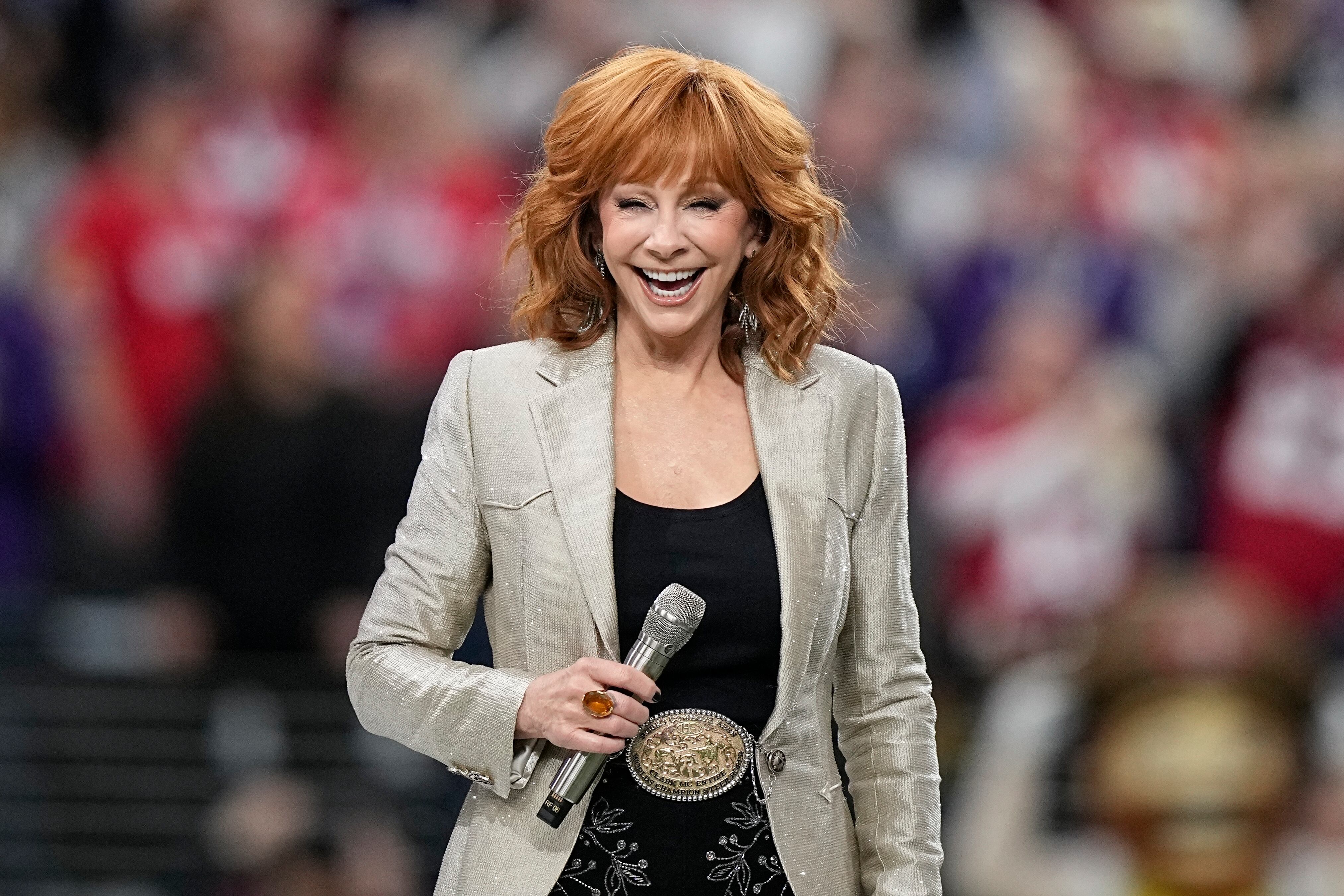 Reba McEntire receives a bouquet of corn dogs to honor her 40th Grand Ole Opry anniversary