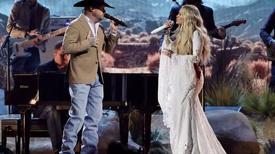 NASHVILLE, TENNESSEE - NOVEMBER 20: EDITORIAL USE ONLY (L-R) Cody Johnson and Carrie Underwood perform onstage during The 58th Annual CMA Awards at Bridgestone Arena on November 20, 2024 in Nashville, Tennessee. (Photo by Theo Wargo/Getty Images)