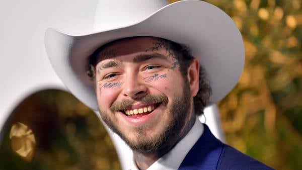 Post Malone says he was “hammered” when he got his first face tattoo